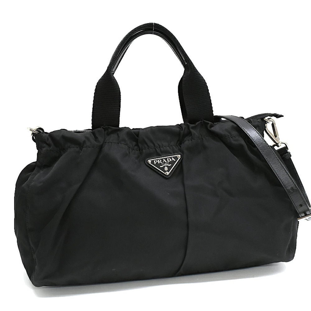 Prada handbag leather black triangle plate